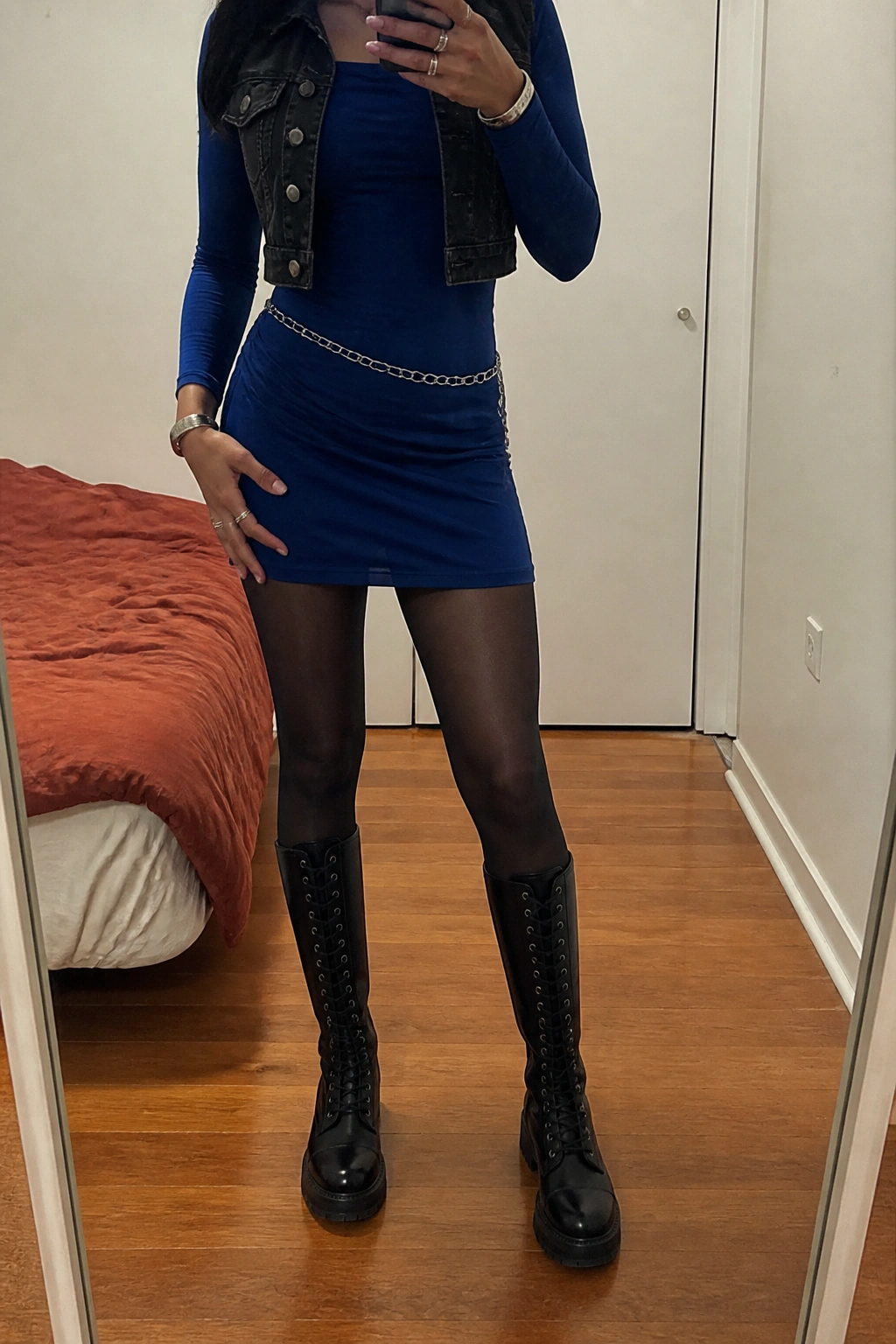 Woman wearing CURFEW boots in a casual bedroom mirror photo